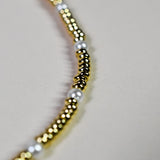 Close-up of the luxurious INDIVIJWL Gold and Pearl Beaded Choker Necklace, featuring 24k gold-filled spacer beads and shell pearls. Tarnish-resistant and 16 inches in length, symbolizing emotional balance and timeless beauty.