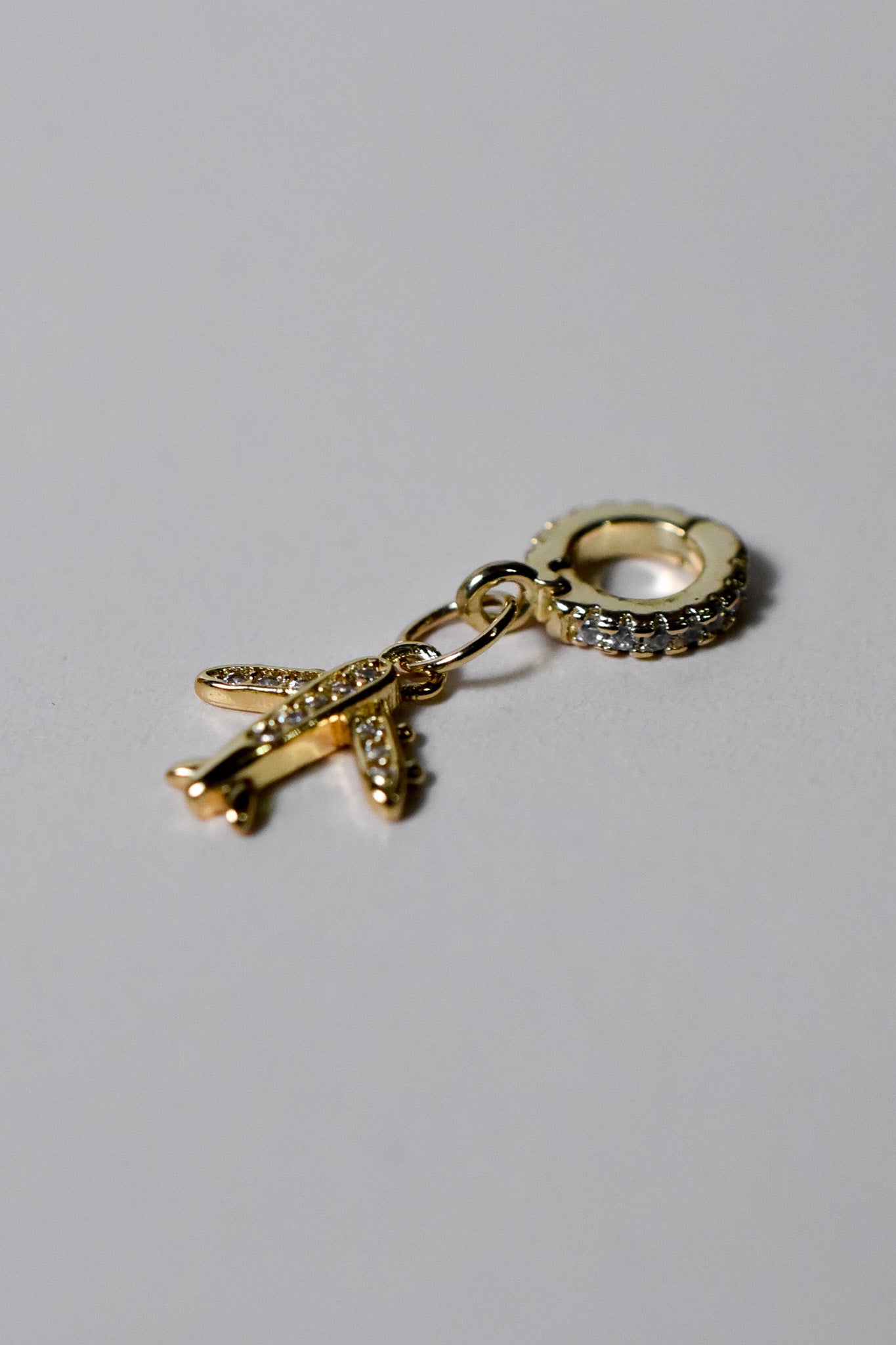 INDIVIJWL airplane charm with 6K gold filled micro paved cubic zirconia, featuring a removable and interchangeable bail charm holder for easy customization. Perfect for travel-themed jewelry or charm necklaces and bracelets.