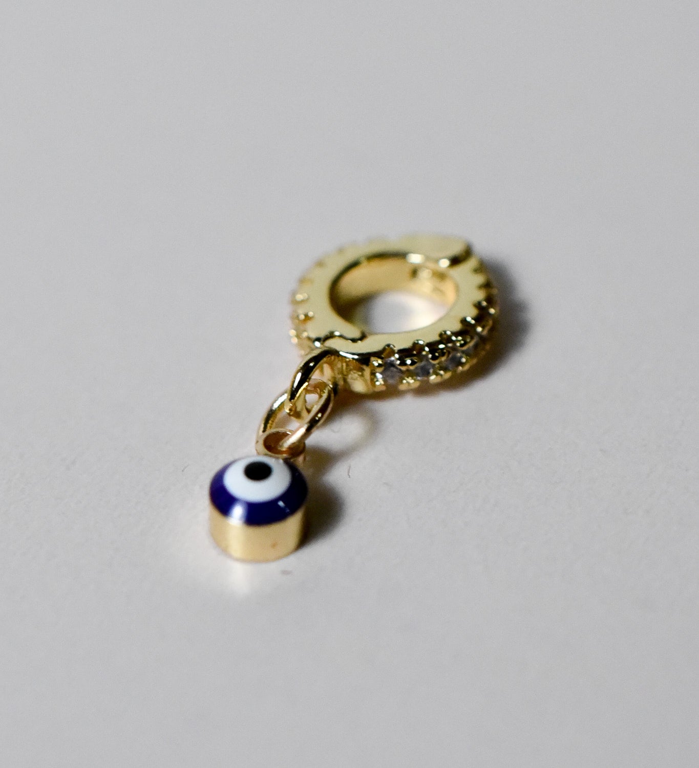 INDIVIJWL blue evil eye charm with 6K gold filled micro paved cubic zirconia and a removable, interchangeable bail charm holder. Perfect for adding protection and style to customizable jewelry pieces.