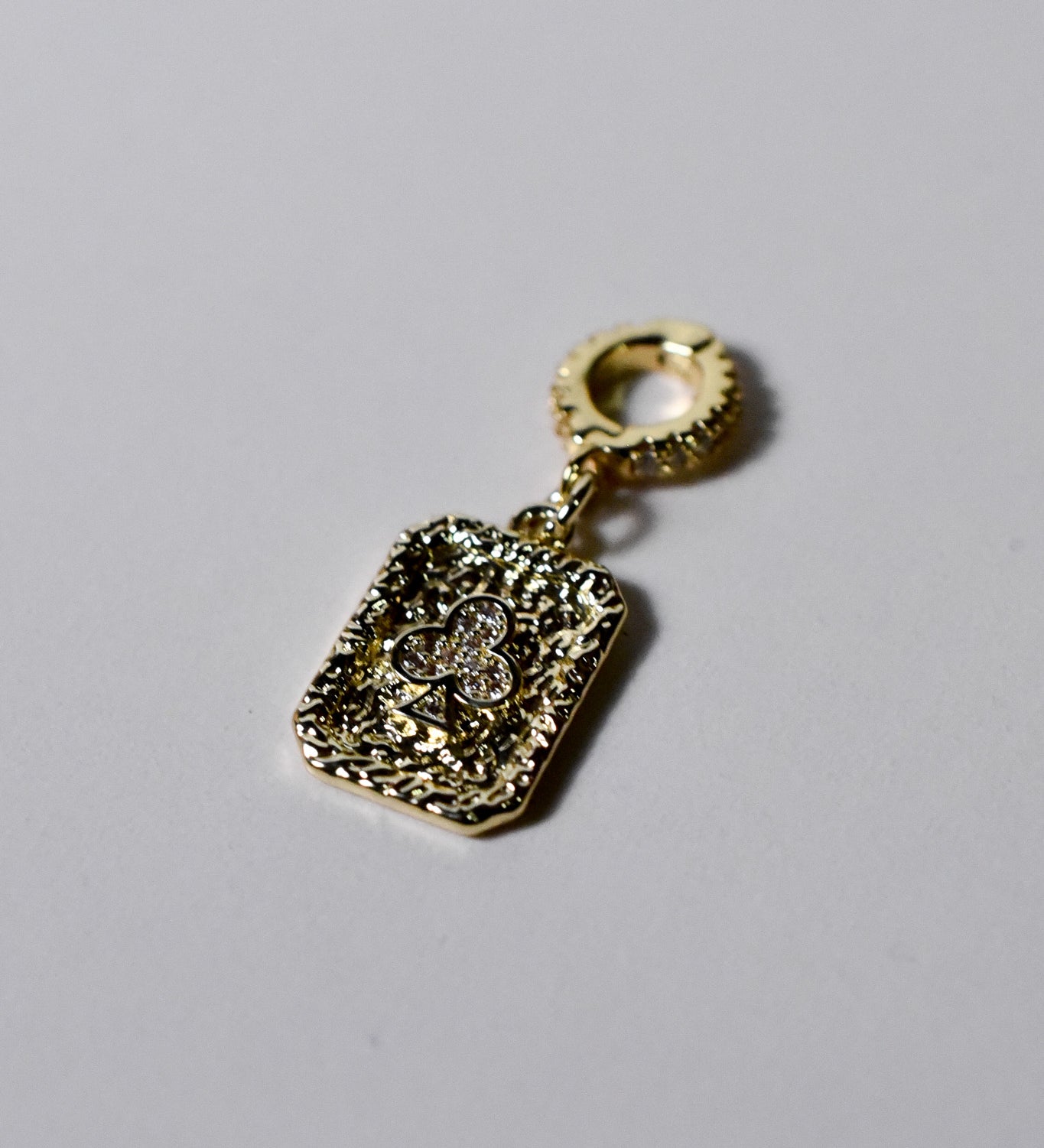 Luxurious 14k gold-filled club pendant charm by INDIVIJWL, crafted with intricate detailing and a cubic zirconia accent, paired with a 16k gold-filled removable bail. A statement of uniqueness and personal style.